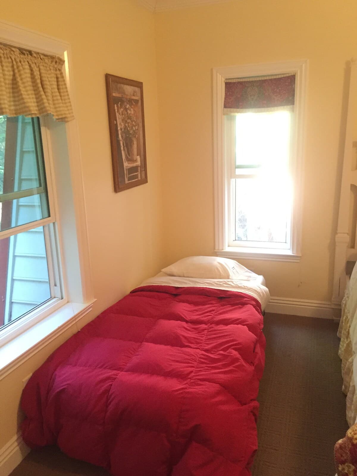 Twin bed near the window in one bedroom