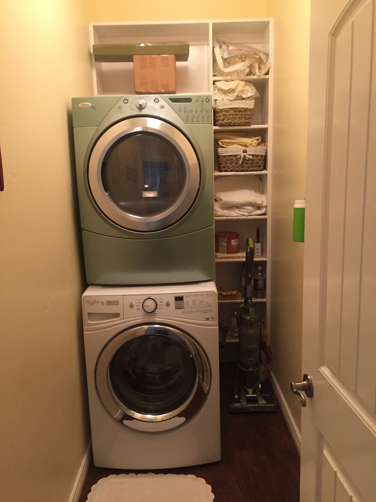 Laundry closet with stacked washer and dryer